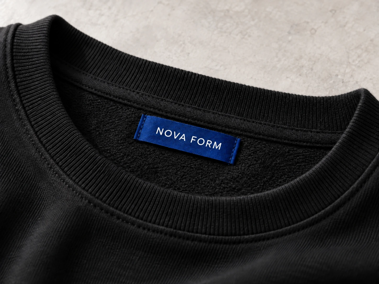 Concept photograph of a woven brand label inside a sweatshirt