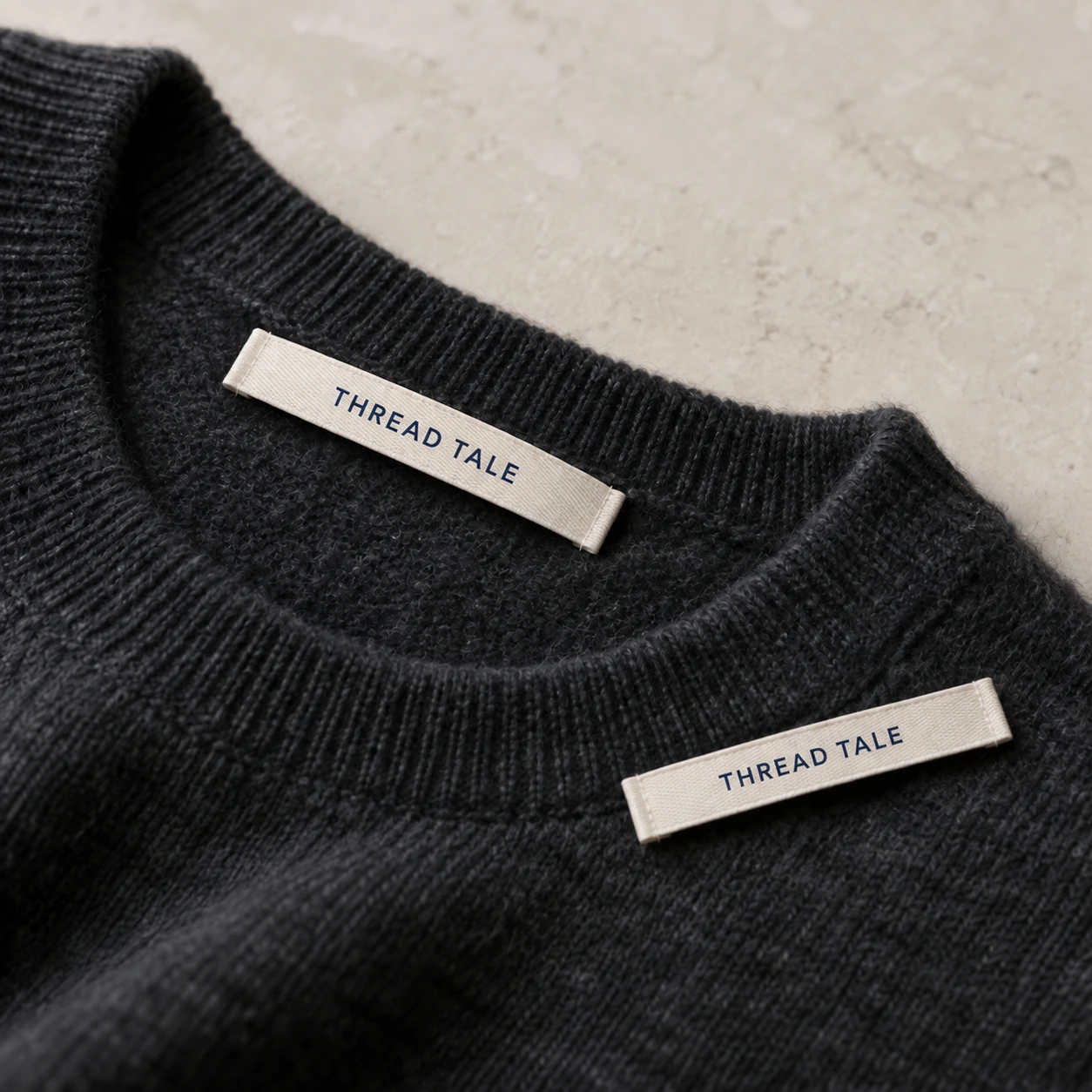 Narrow shuttle-woven label with natural long-edge selvages